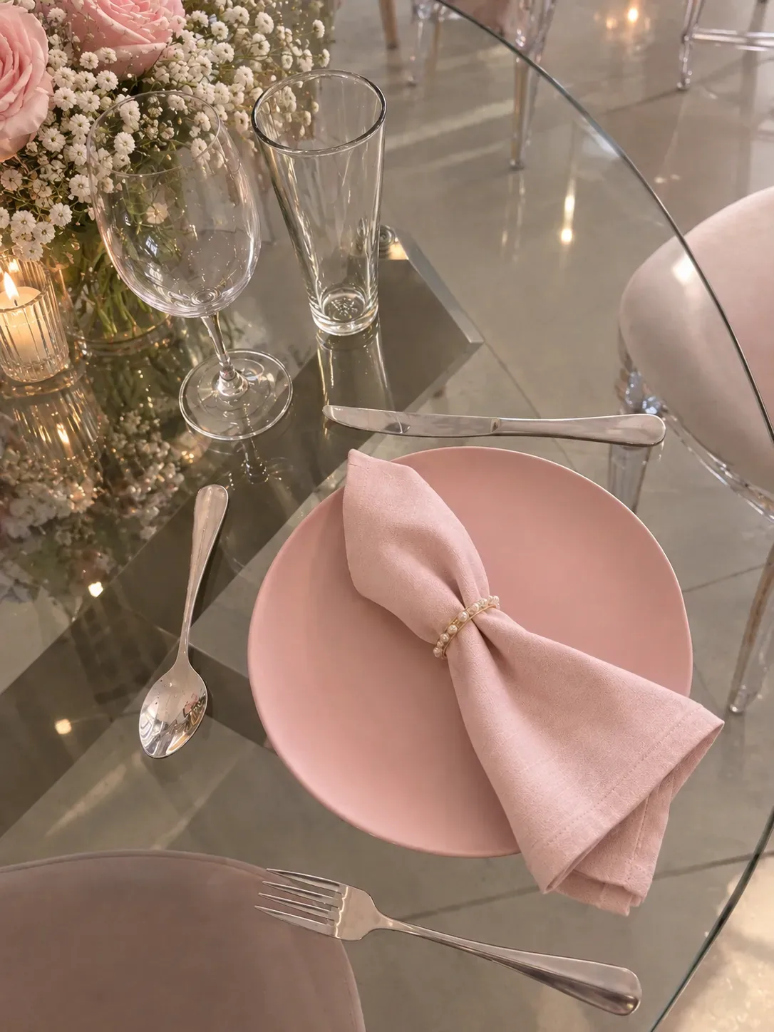 Pink-themed table arrangement with coordinated event decor